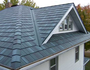 Unique and durable teal-colored metal shingle roof.