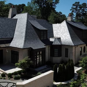 Beautiful luxury home with a professionally installed dark slate roof