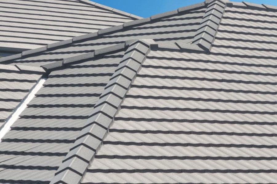 Sleek, flat profile concrete tiles in a modern grey finish.