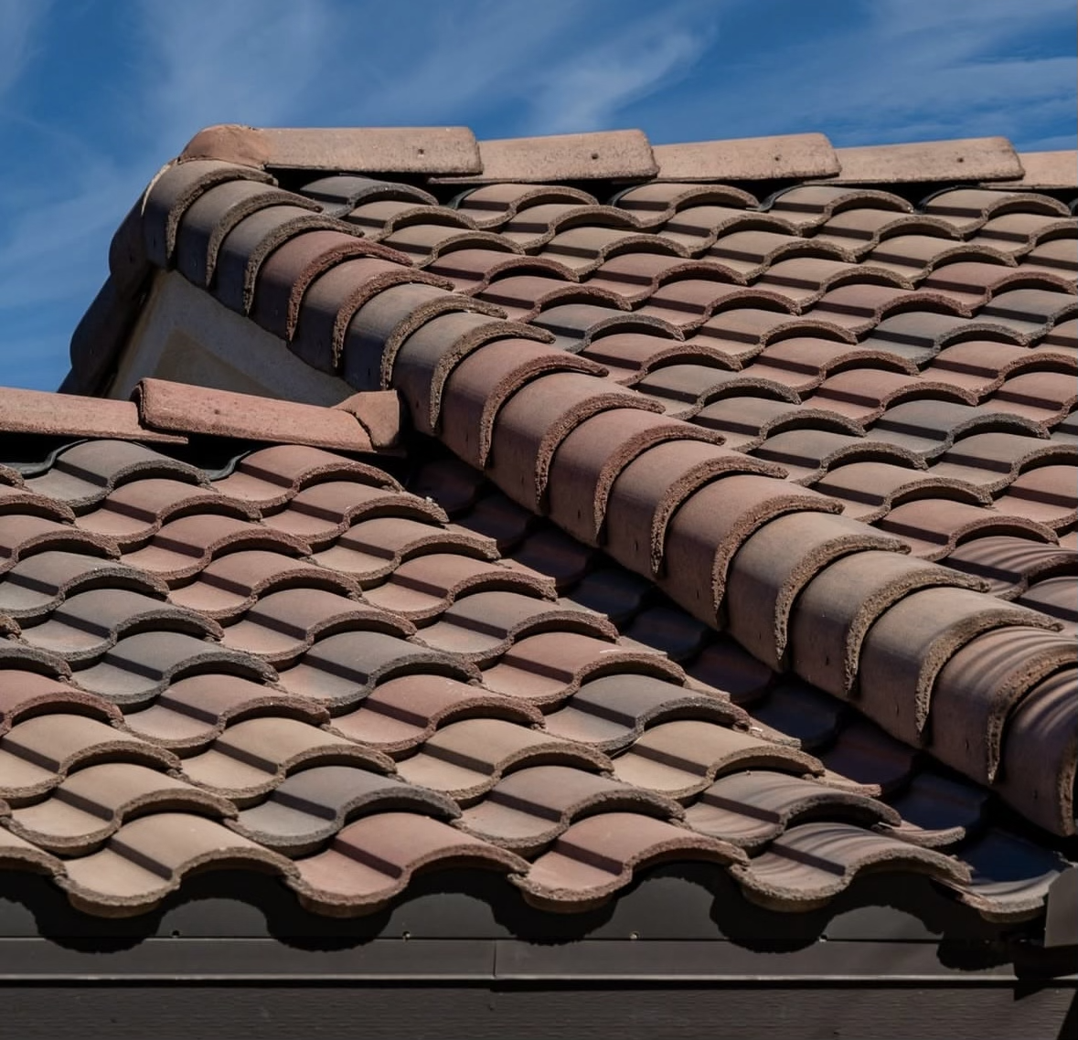 A close-up of beautiful, multi-tonal clay tiles that add character and depth.